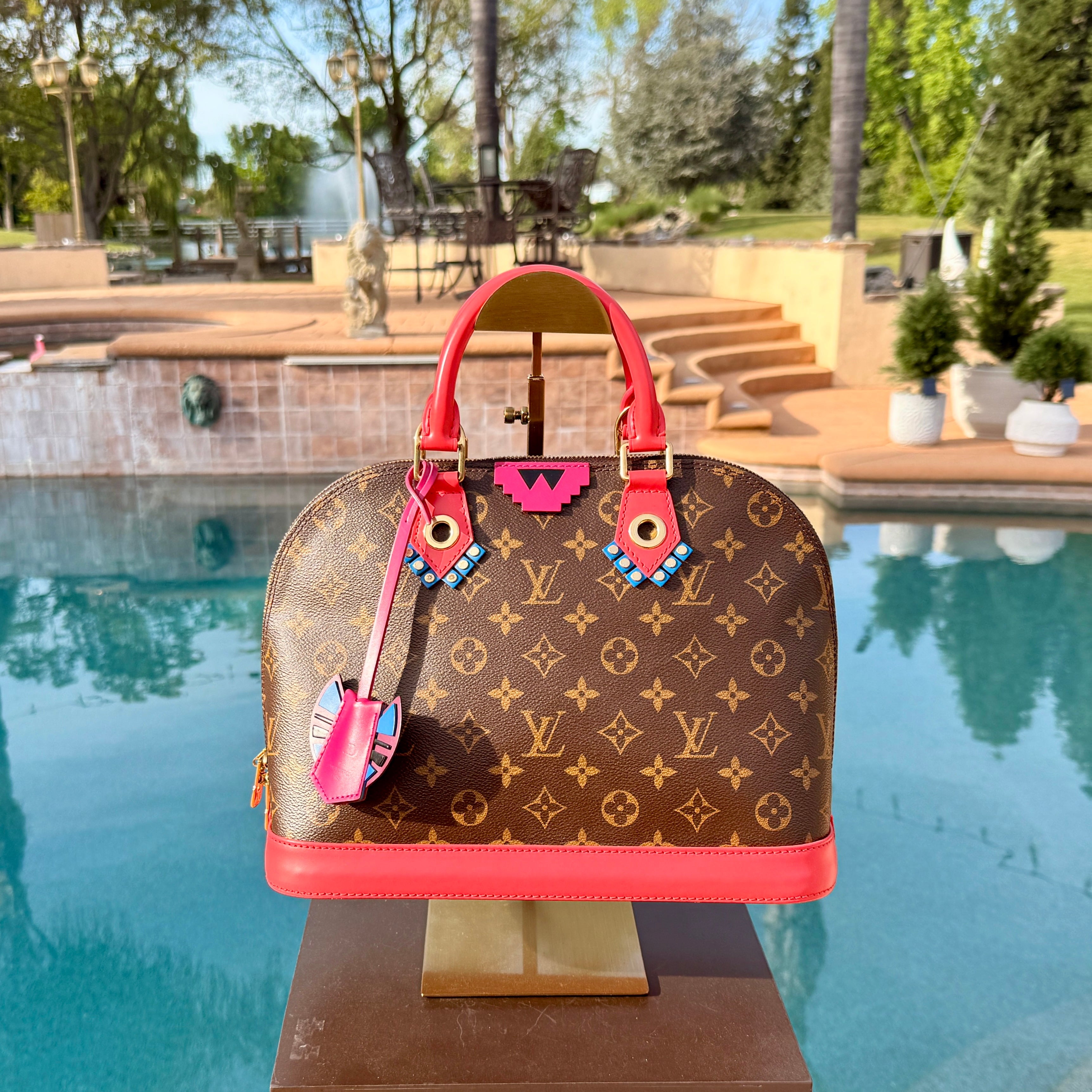 Louis Vuitton	Limited Edition Monogram Totem Alma PM Flamingo